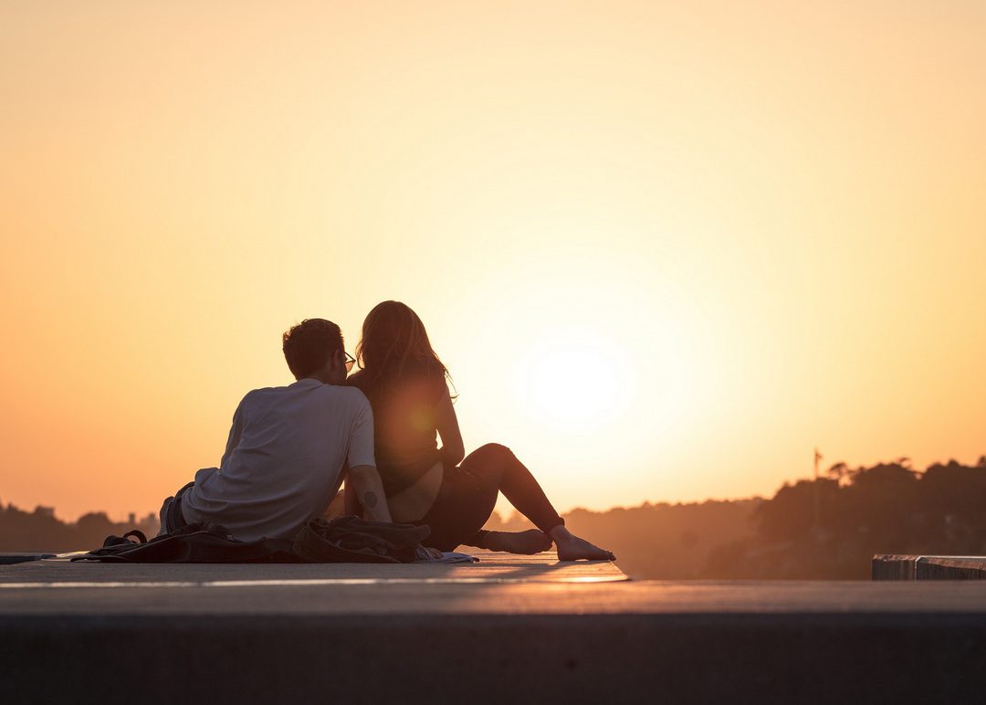 south-african-singles A picture of a man and a woman sitting looking at the sunset